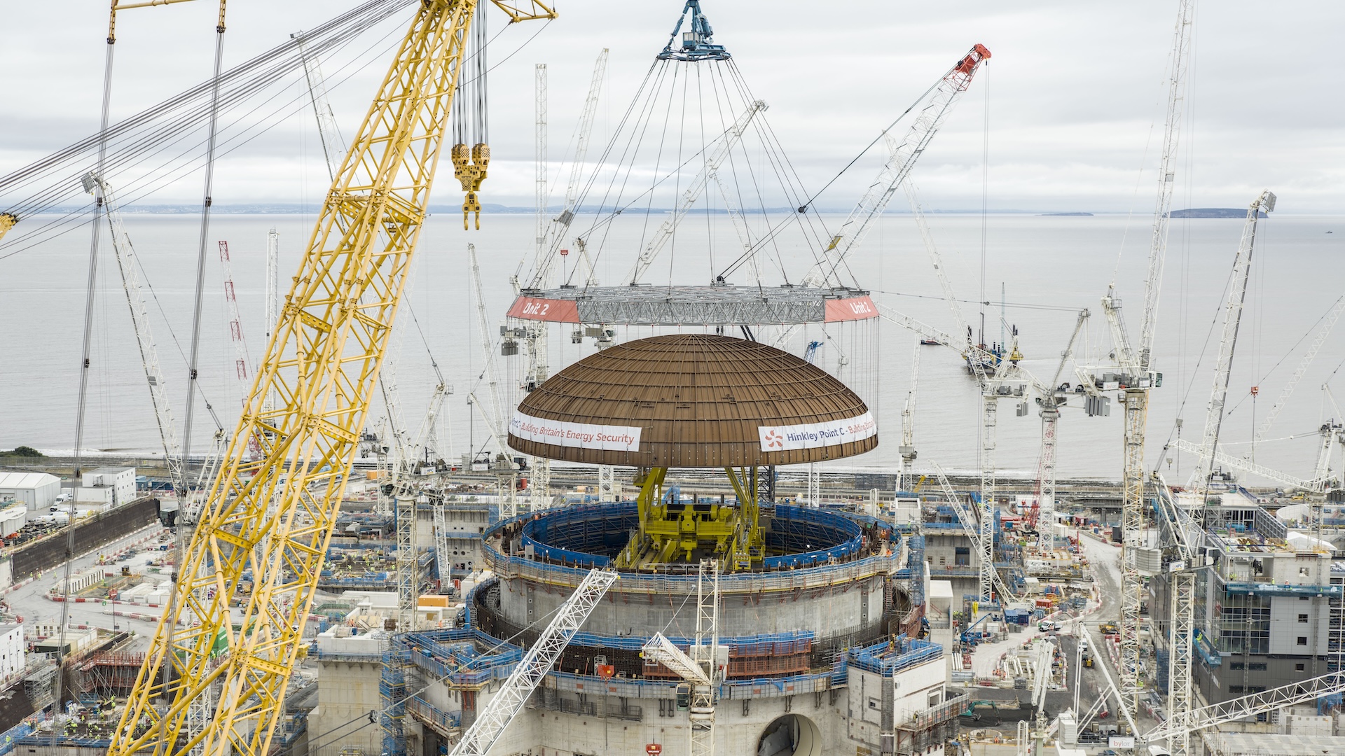 World’s largest construction crane lifts a 245-ton dome onto a nuclear reactor building