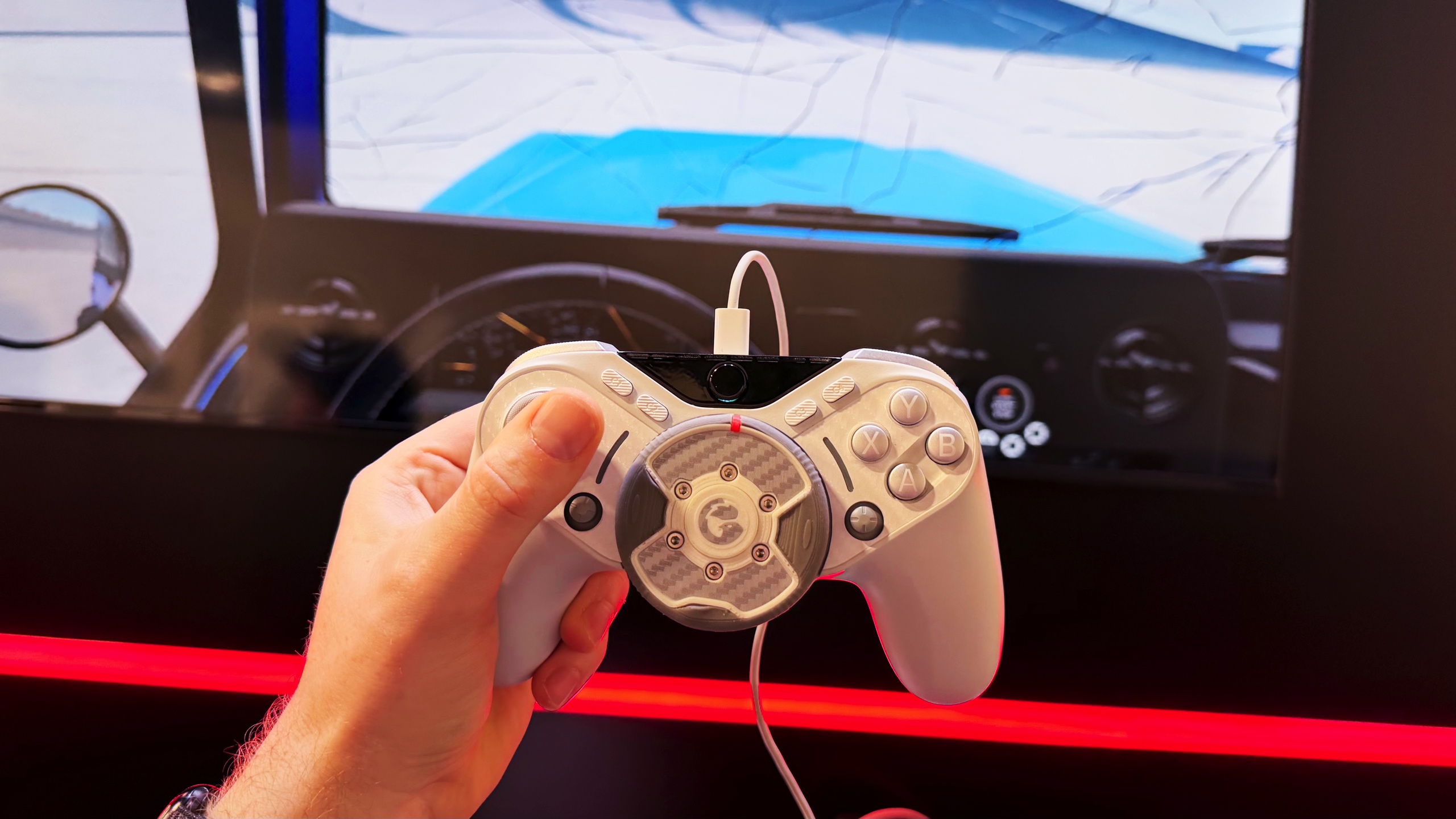 This game controller has a force feedback steering wheel lodged in the middle