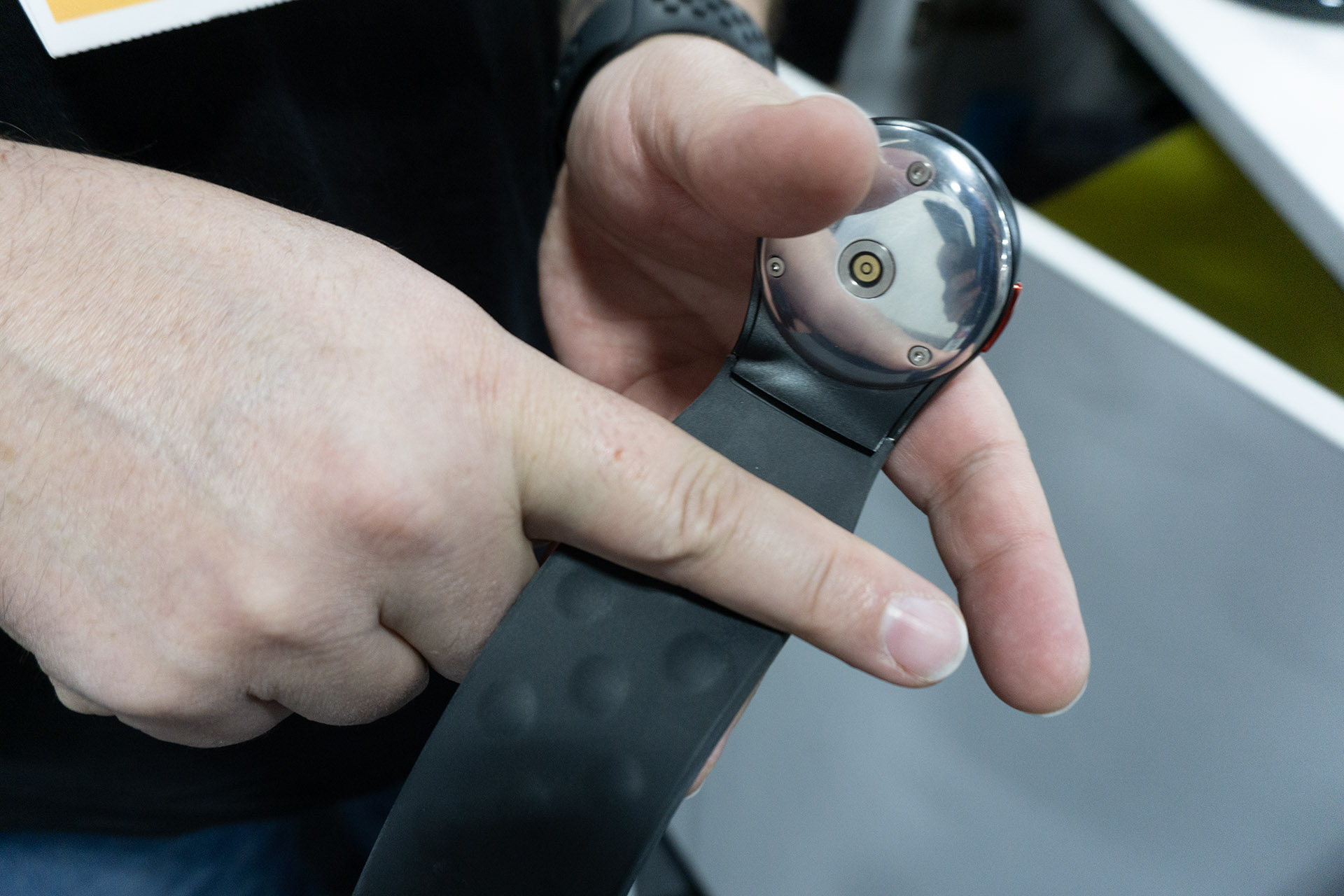 This haptic wristband pairs with Meta smart glasses to decode facial expressions