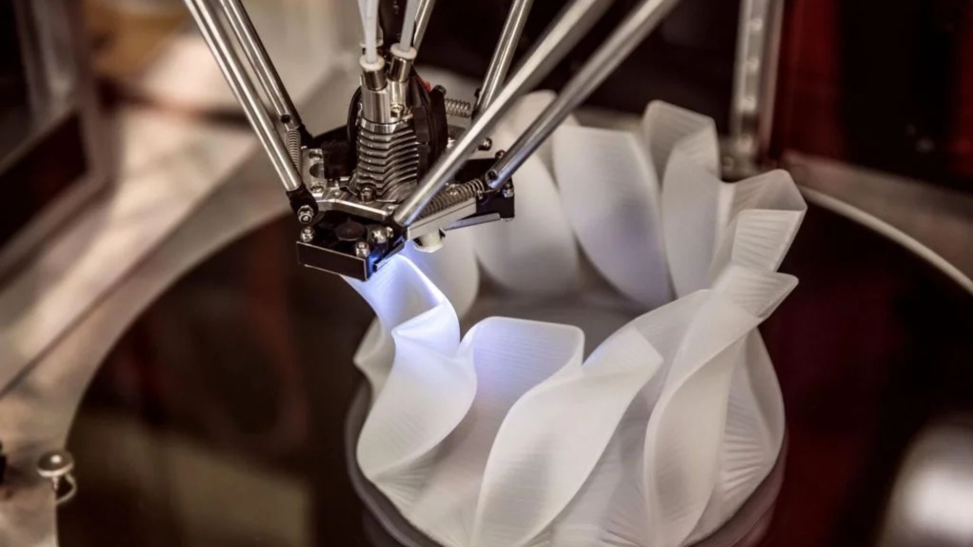 Laser-assisted 3D printing shapes ultra-hard tungsten carbide while cutting waste