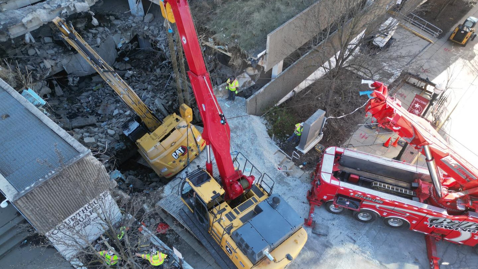 World’s largest tow truck rescues 135,000-lb excavator from parking garage