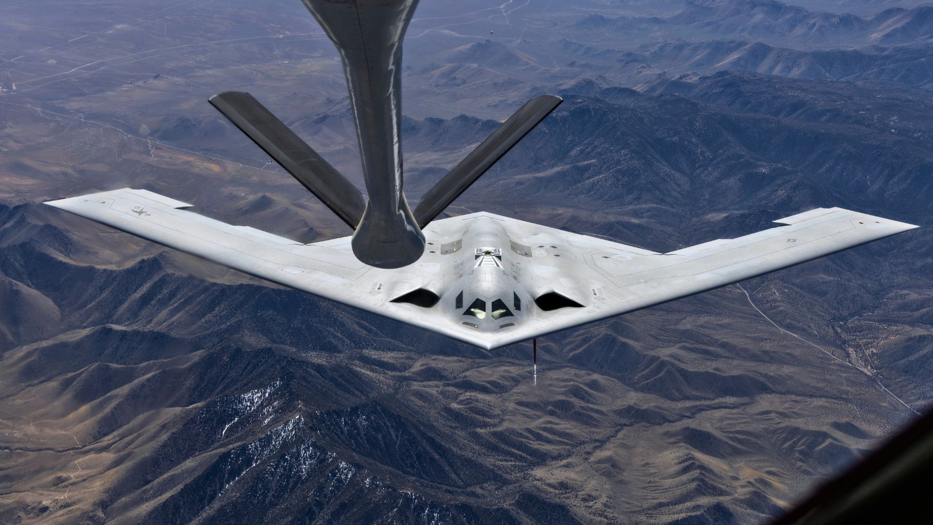 B-21 Raider seen from above in aerial refueling test, exposes key features
