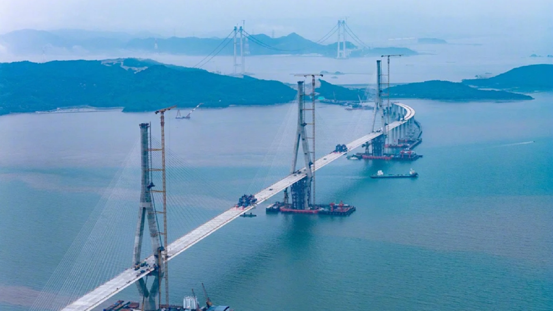 World’s longest three-tower cable bridge and sea railway bridge near completion in China
