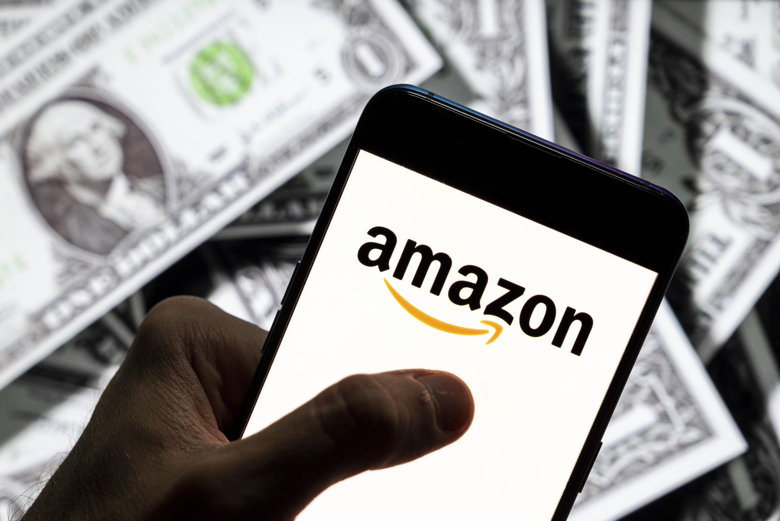 Amazon raises minimum wage by $1