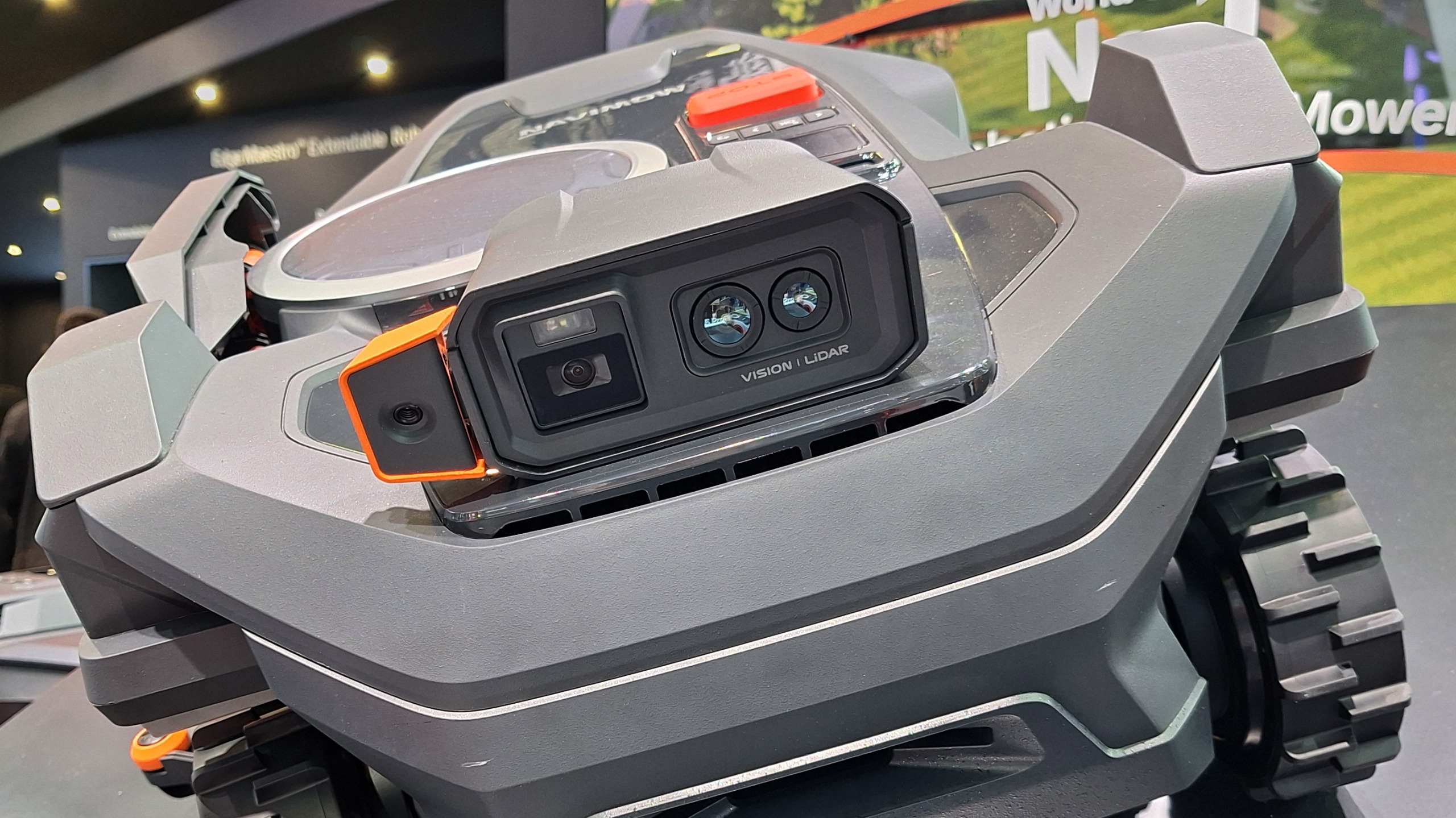I just saw a lawnbot with a mechanical arm that reaches out to hand-trim your edges — and it was mesmerizing
